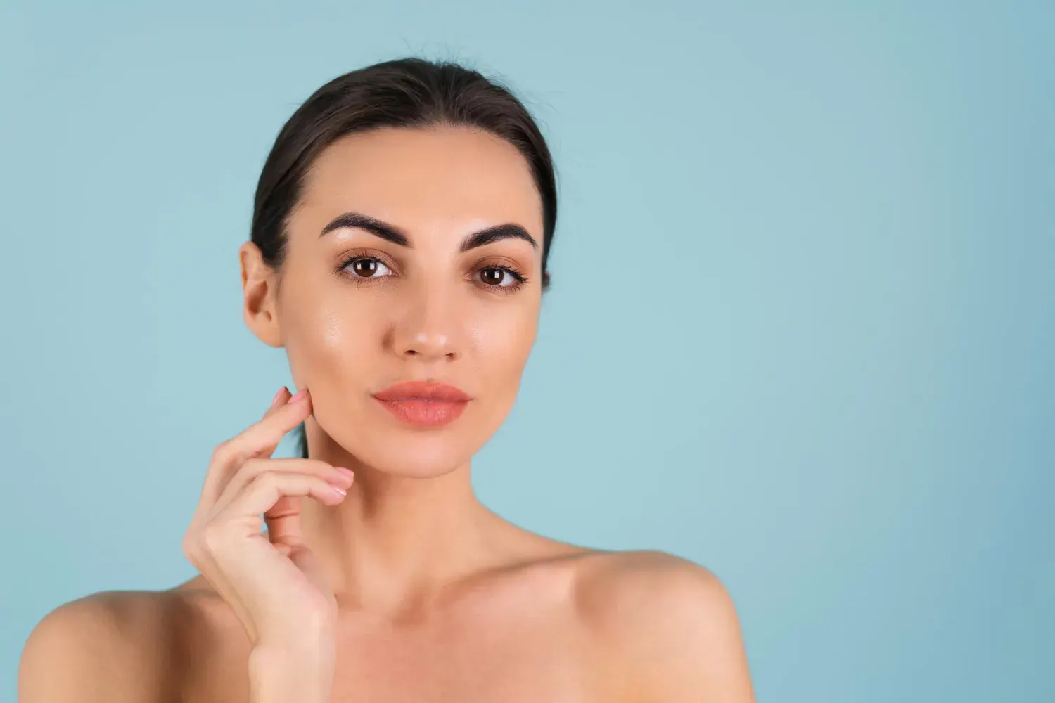 Forma RF device handpiece gliding over facial skin for tightening treatment in London
