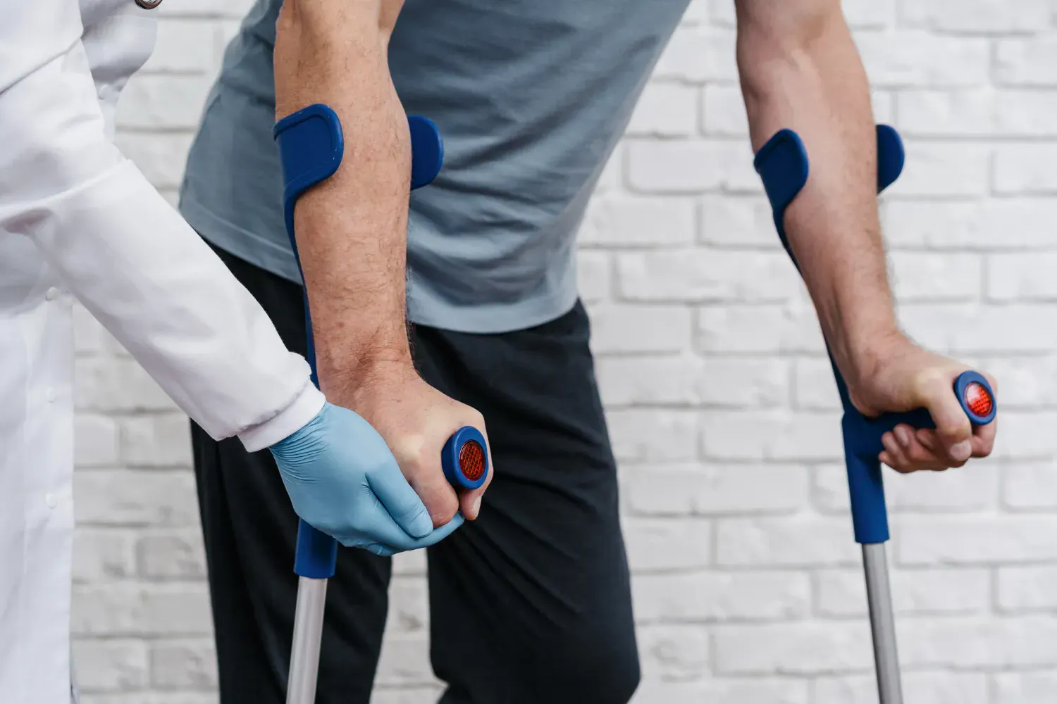 Patient receiving knee injection at orthopedic clinic